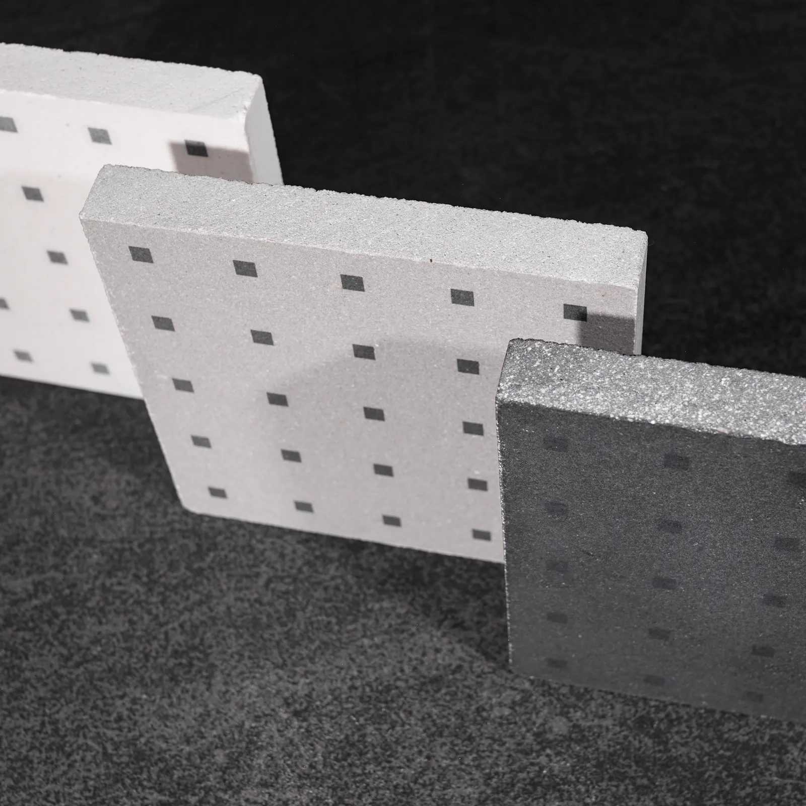 White, grey, and black single-layer cement tiles for floors and walls, featuring a low-thickness profile and matte protective finish